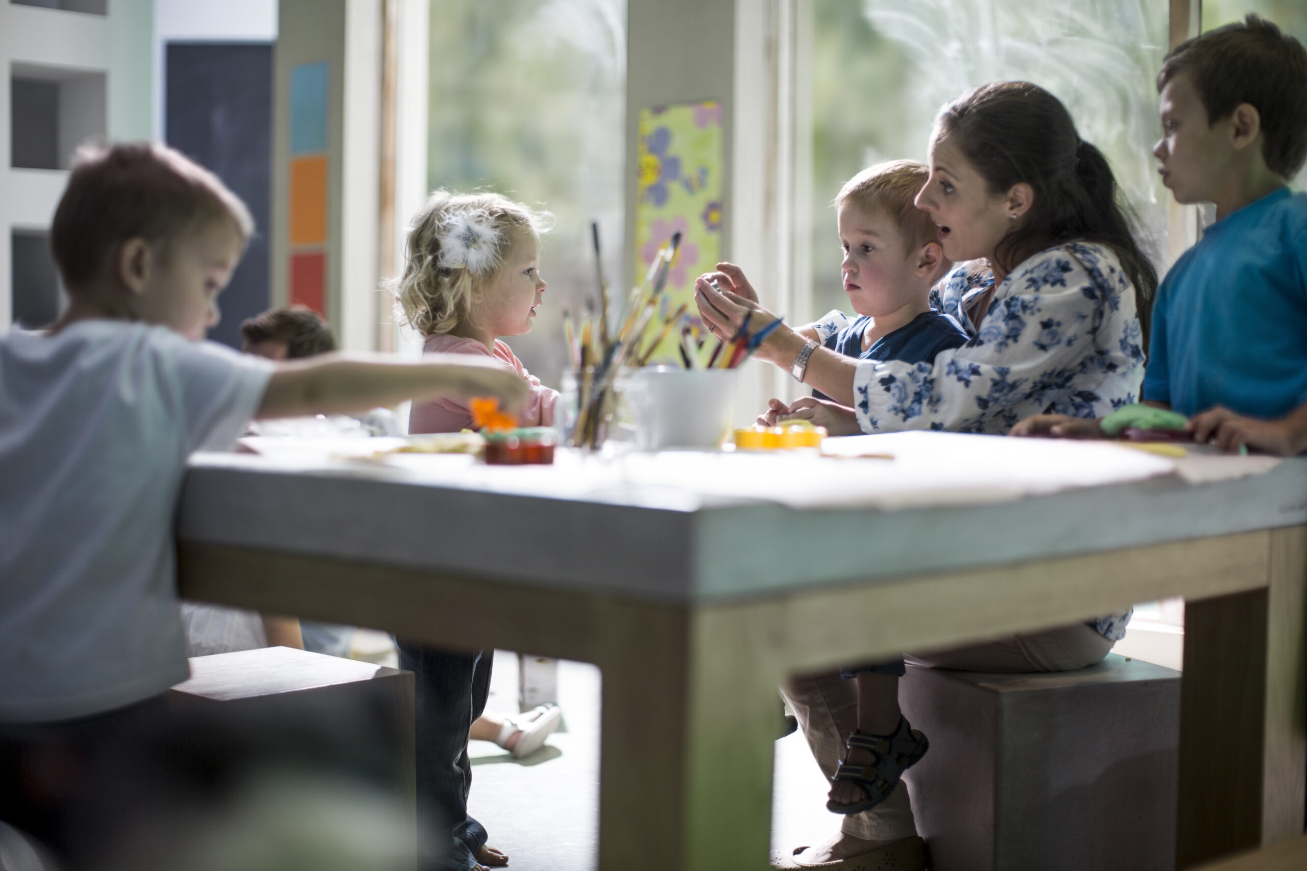 teacher and children drawing